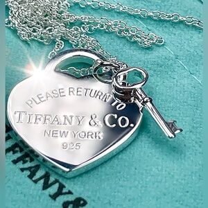 Authentic Tiffany & Co. Silver Heart Stamped Pendant and Key Necklace.